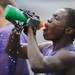 A Pioneer High School football player takes a water break during the first day of practice on Monday, August 12, 2013. Melanie Maxwell | AnnArbor.com